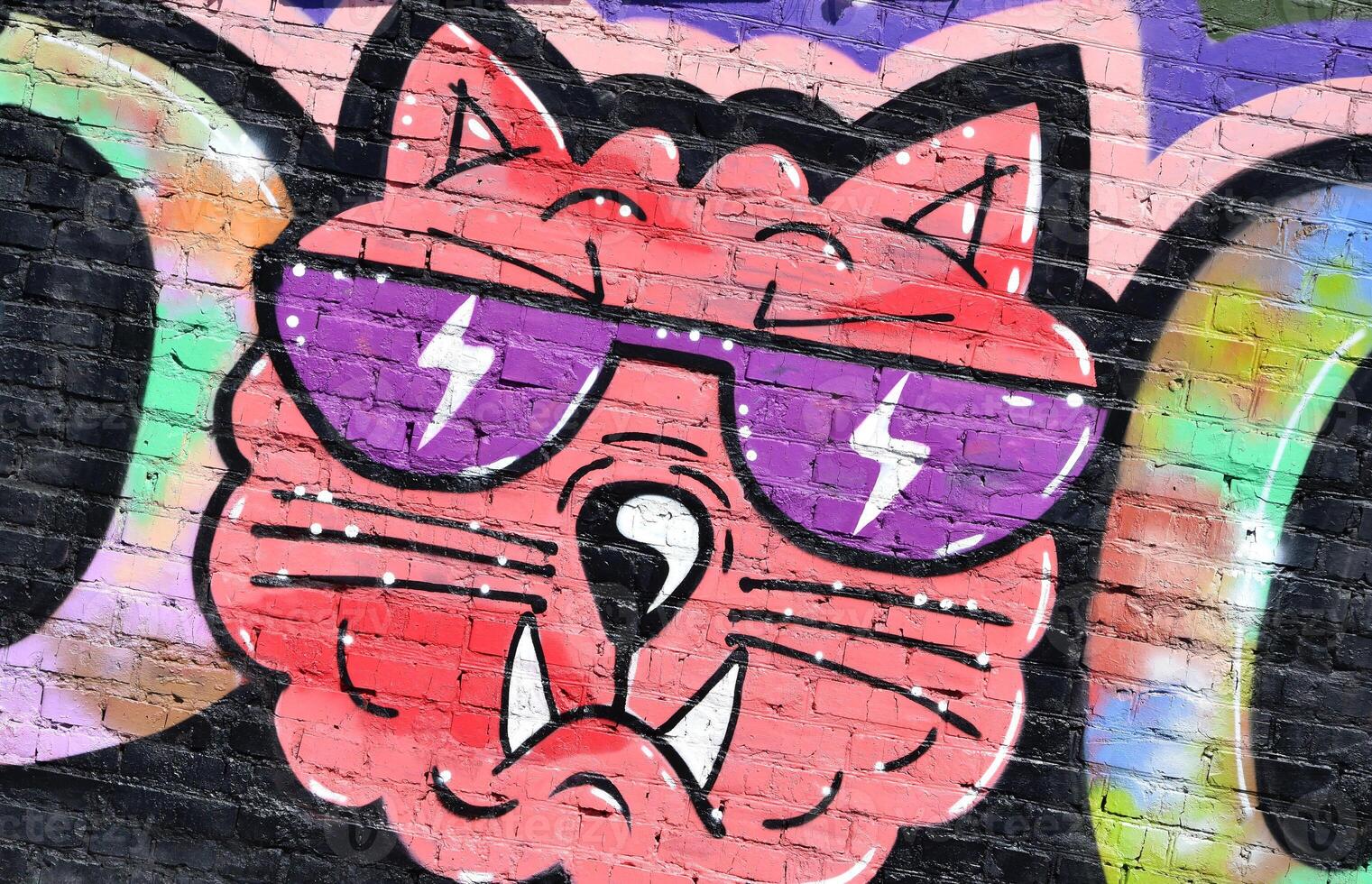 Colorful background of graffiti painting artwork with bright aerosol outlines on wall. Old school street art piece made with aerosol spray paint cans. Contemporary youth culture photo
