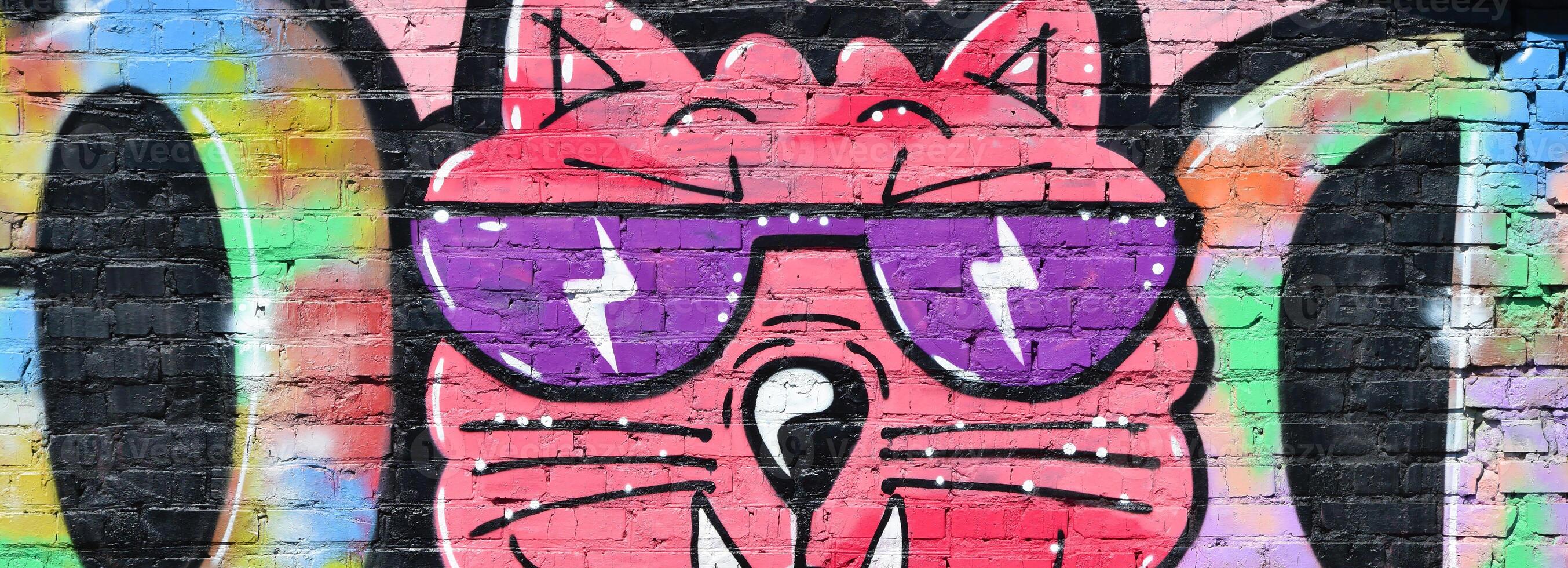 Colorful background of graffiti painting artwork with bright aerosol outlines on wall. Old school street art piece made with aerosol spray paint cans. Contemporary youth culture photo