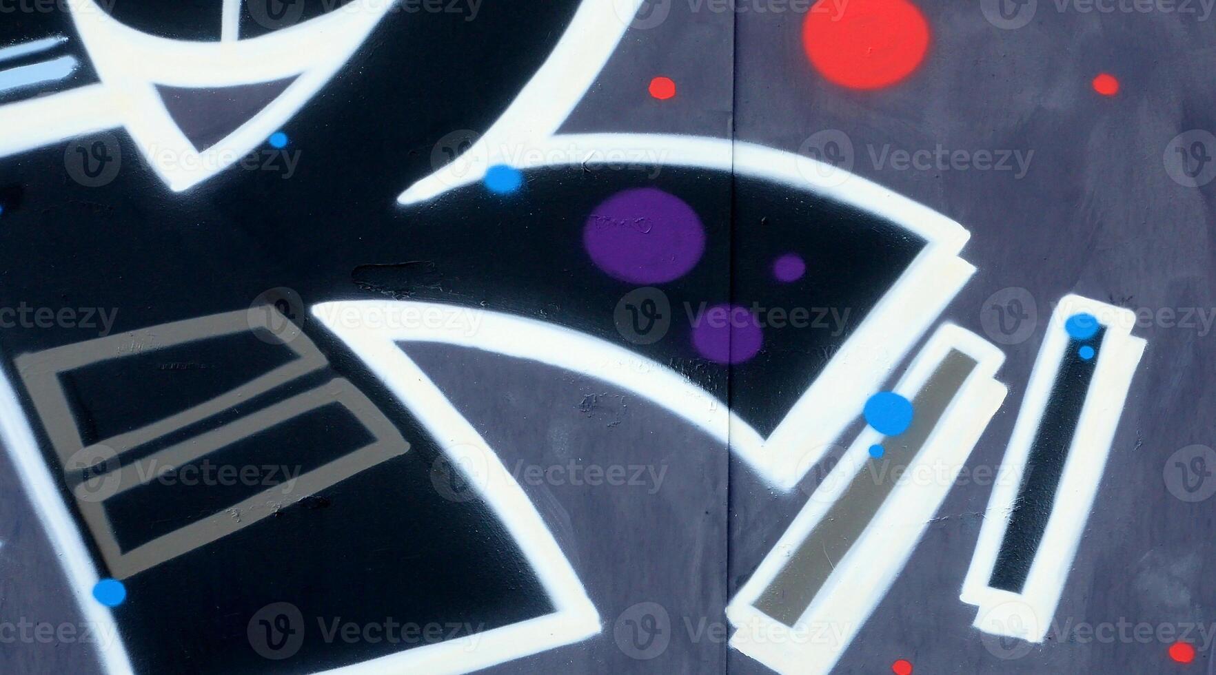 Colorful background of graffiti painting artwork with bright aerosol outlines on wall. Old school street art piece made with aerosol spray paint cans. Contemporary youth culture photo