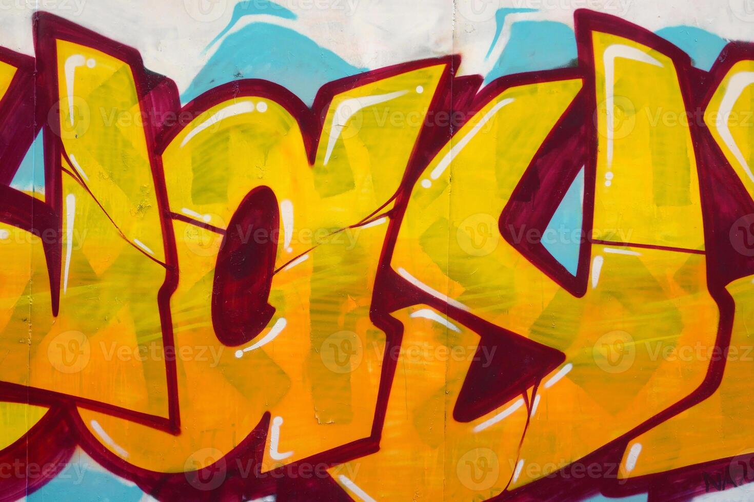 Colorful background of graffiti painting artwork with bright aerosol outlines on wall. Old school street art piece made with aerosol spray paint cans. Contemporary youth culture photo