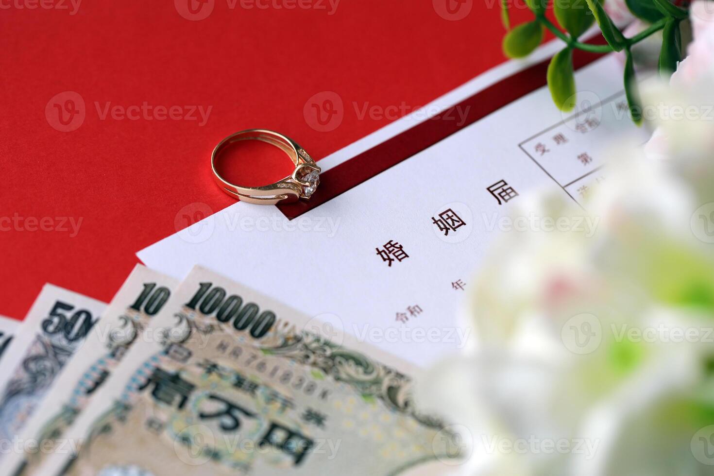 Japanese marriage registration blank document and wedding proposition ring and yen money on table photo