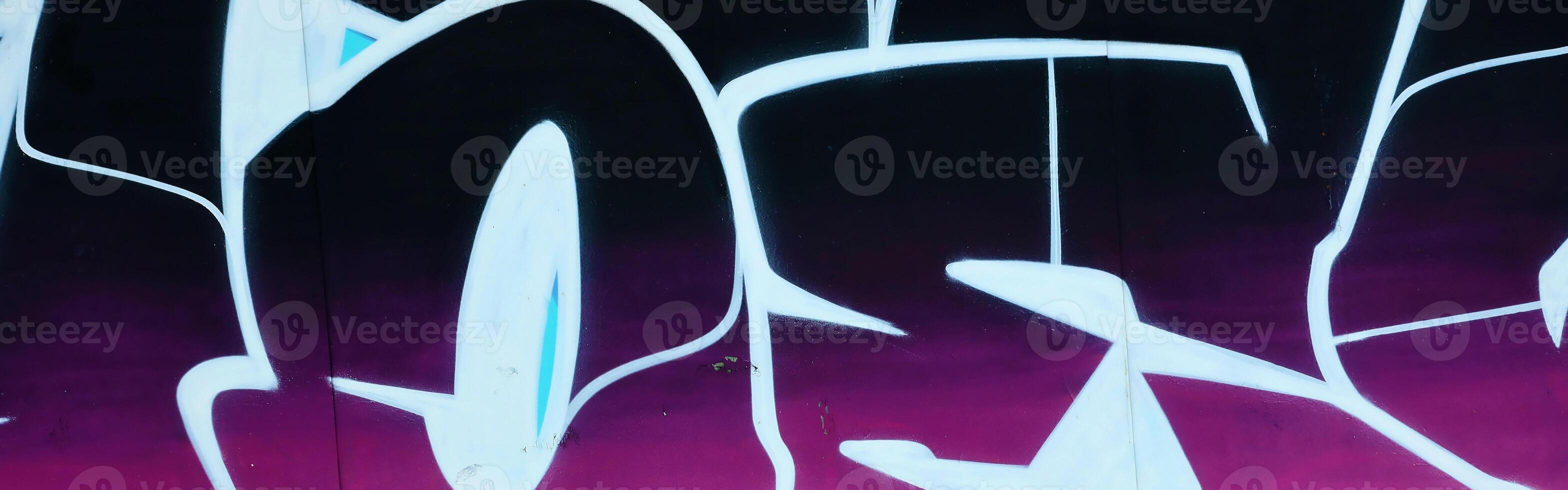 Colorful background of graffiti painting artwork with bright aerosol outlines on wall. Old school street art piece made with aerosol spray paint cans. Contemporary youth culture photo