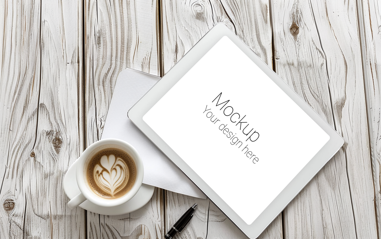 Tablet with coffee and pen on wooden table psd