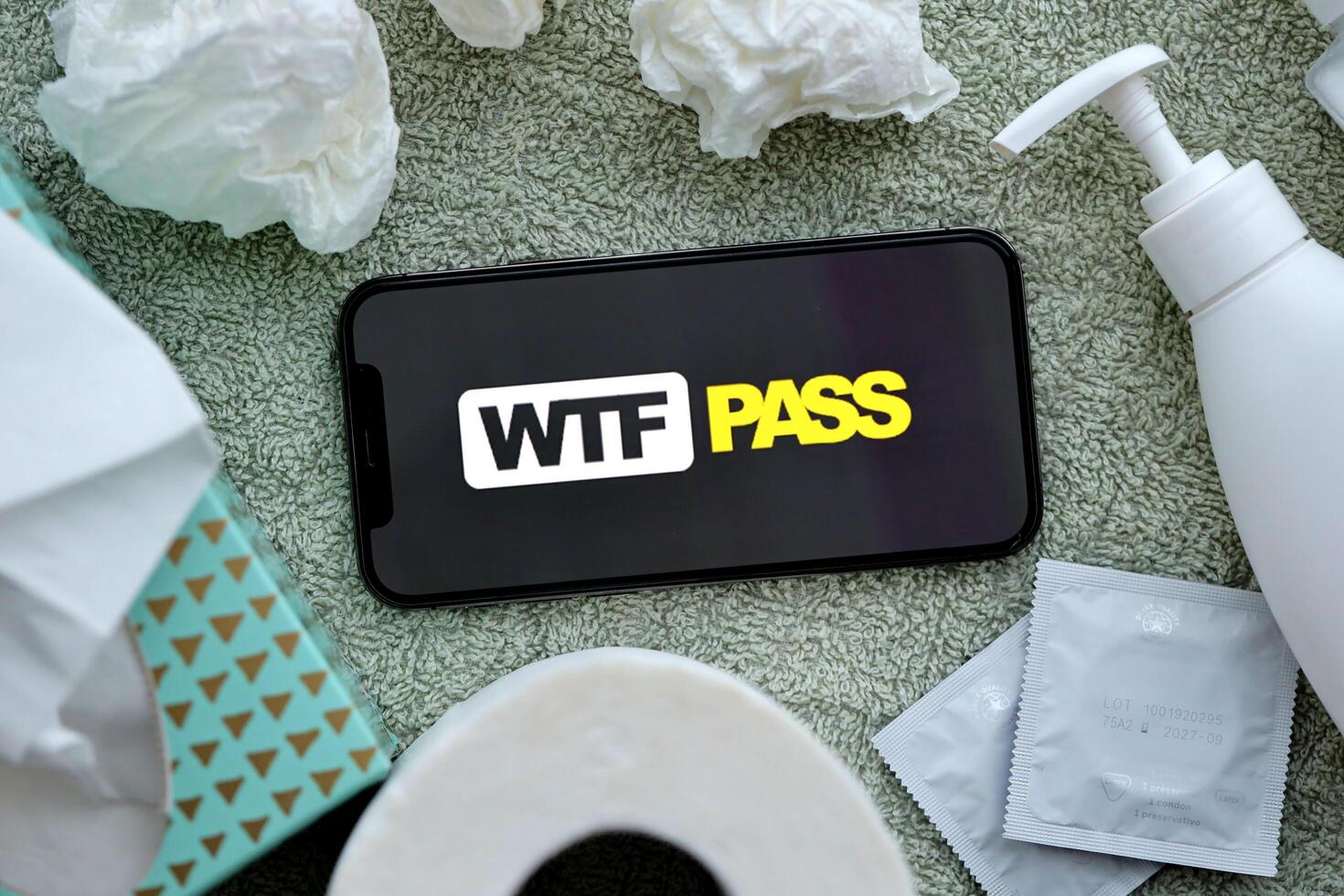 KYIV, UKRAINE - JANUARY 23, 2024 WTFPass adult content website logo on display of iPhone 12 Pro photo