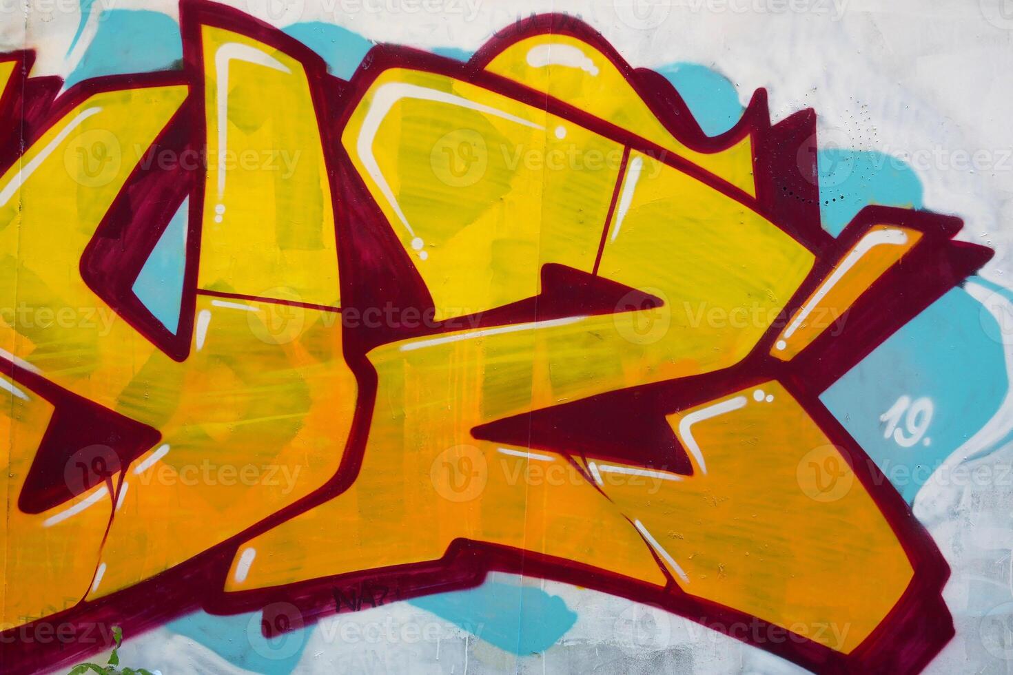 Colorful background of graffiti painting artwork with bright aerosol outlines on wall. Old school street art piece made with aerosol spray paint cans. Contemporary youth culture photo