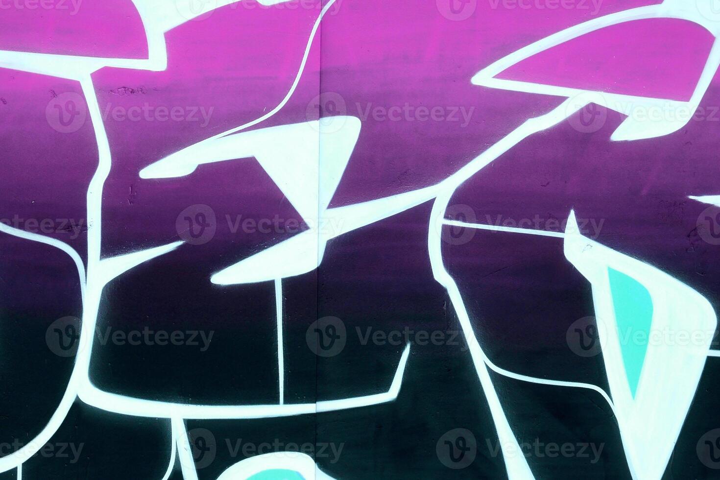 Colorful background of graffiti painting artwork with bright aerosol outlines on wall. Old school street art piece made with aerosol spray paint cans. Contemporary youth culture photo