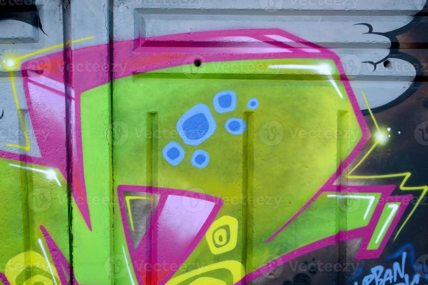 Colorful background of graffiti painting artwork with bright aerosol outlines on wall. Old school street art piece made with aerosol spray paint cans. Contemporary youth culture photo
