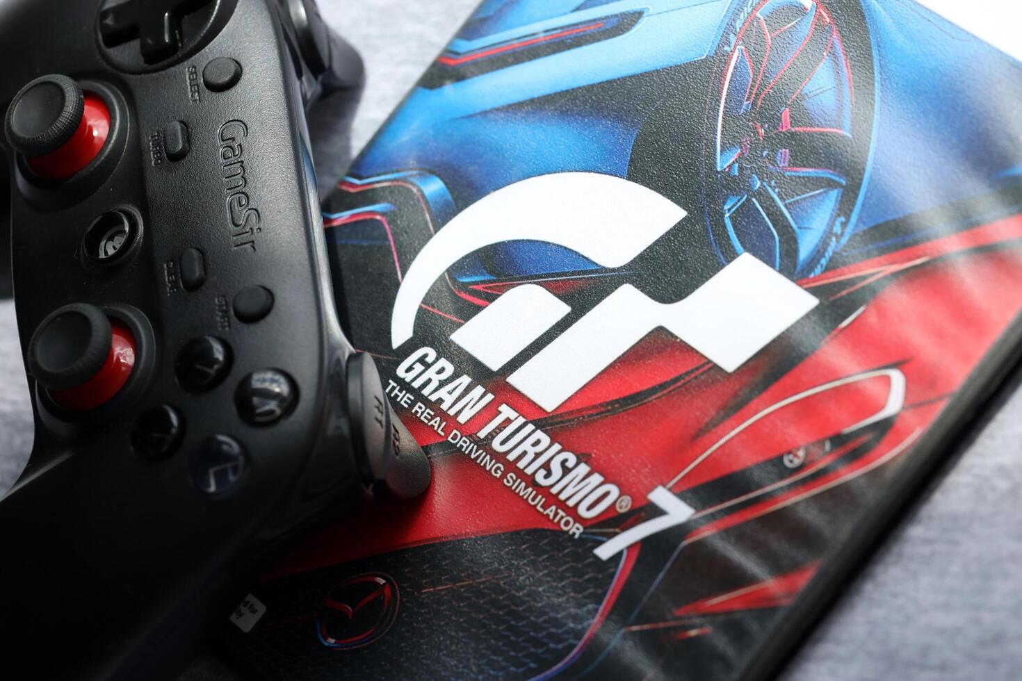 KYIV, UKRAINE - JUNE 26, 2024 Gran Turismo 7 PS5 game disc box for console gaming. Popular game disc photo