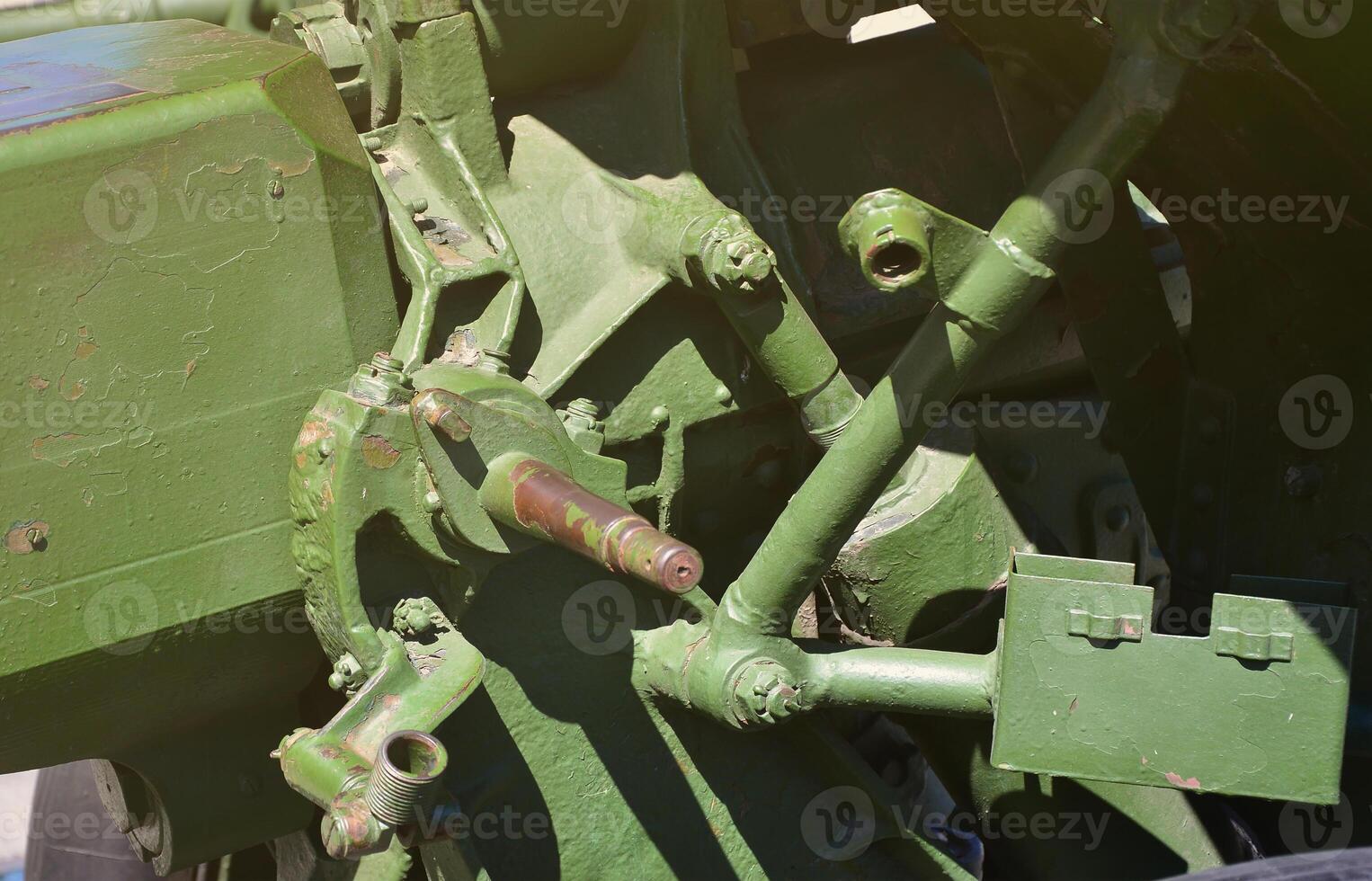 A close-up mechanism of a portable weapon of the Soviet Union of World War II, painted in a dark green color photo