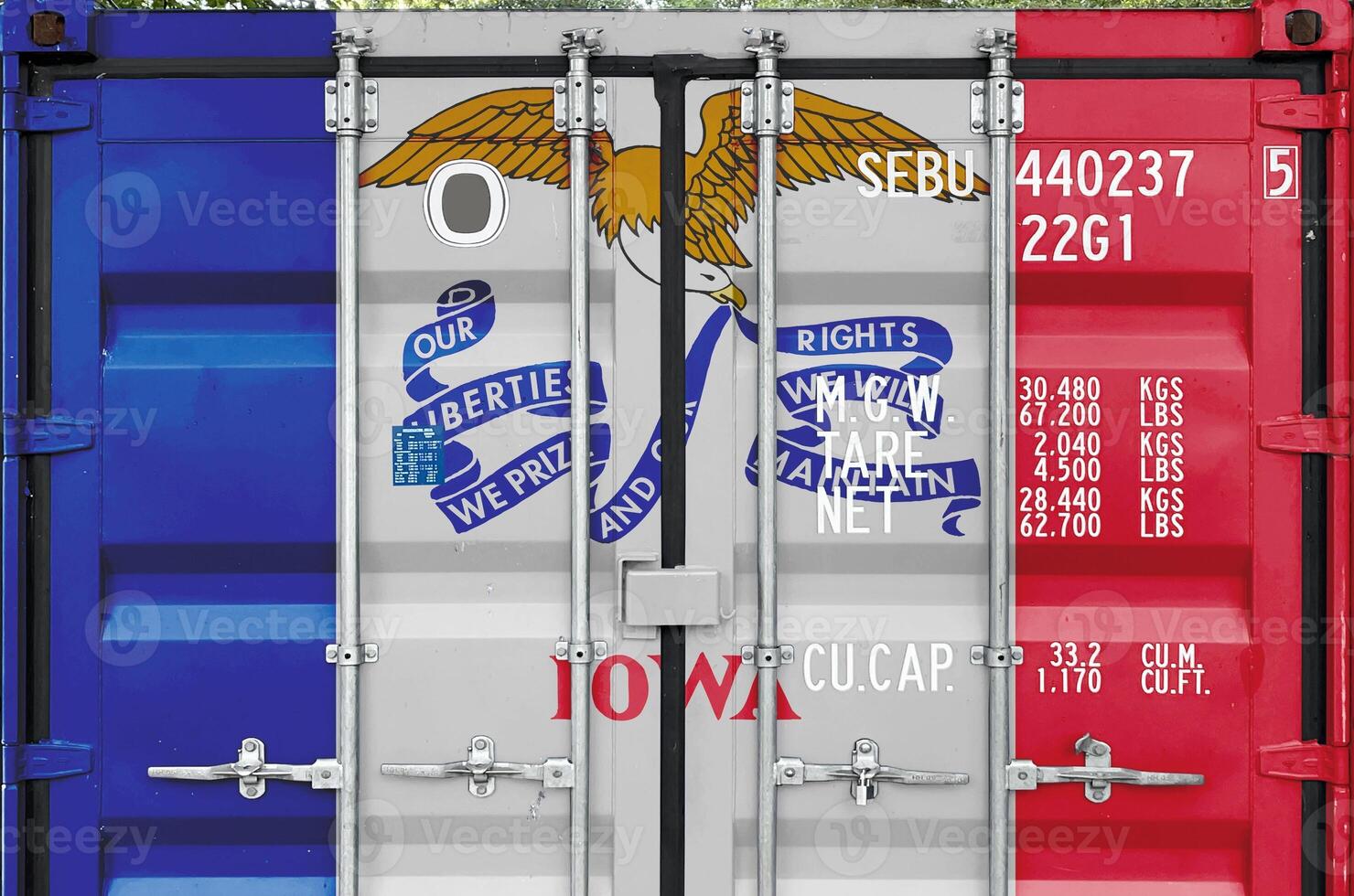 Iowa US state flag depicted on metal doors of shipping cargo container outdoors in docks area photo