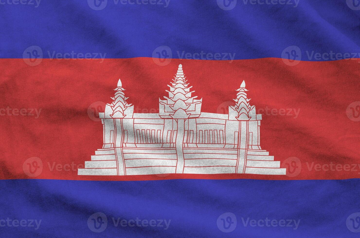 Cambodia flag depicted on folded wavy fabric of old cloth photo