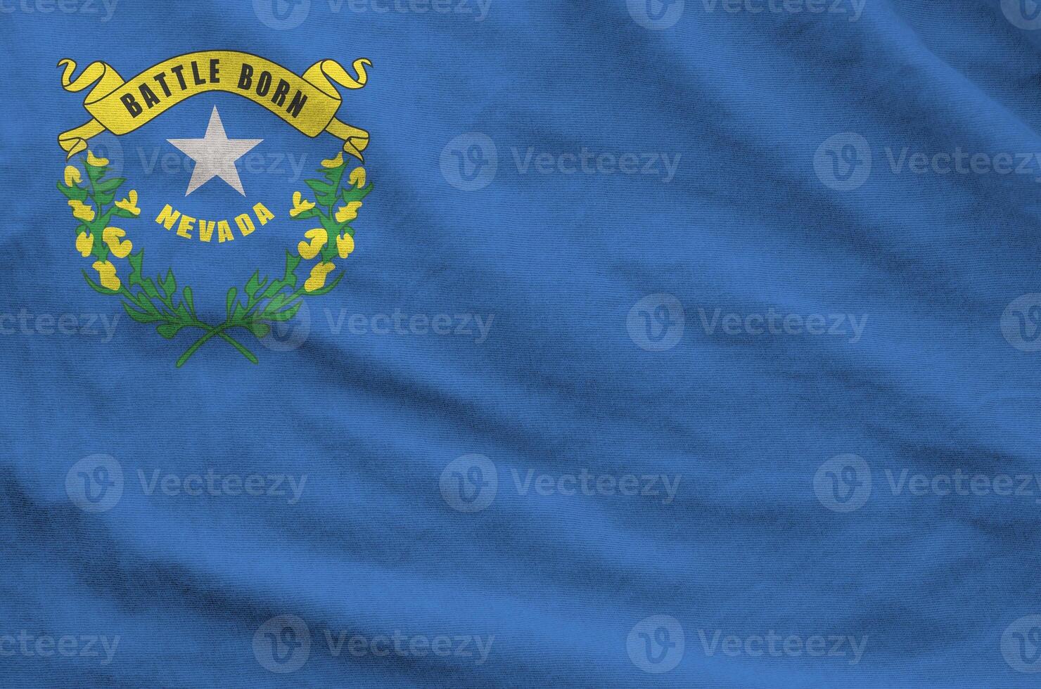 Nevada US state flag depicted on folded wavy fabric of old cloth photo