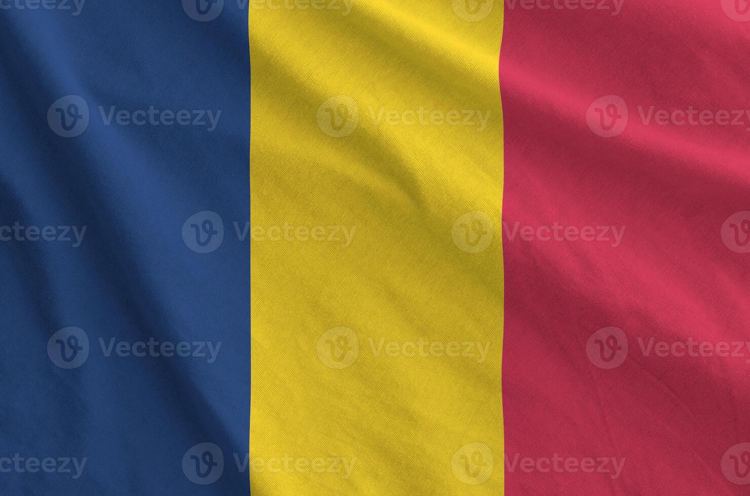 Chad flag depicted on folded wavy fabric of old cloth photo