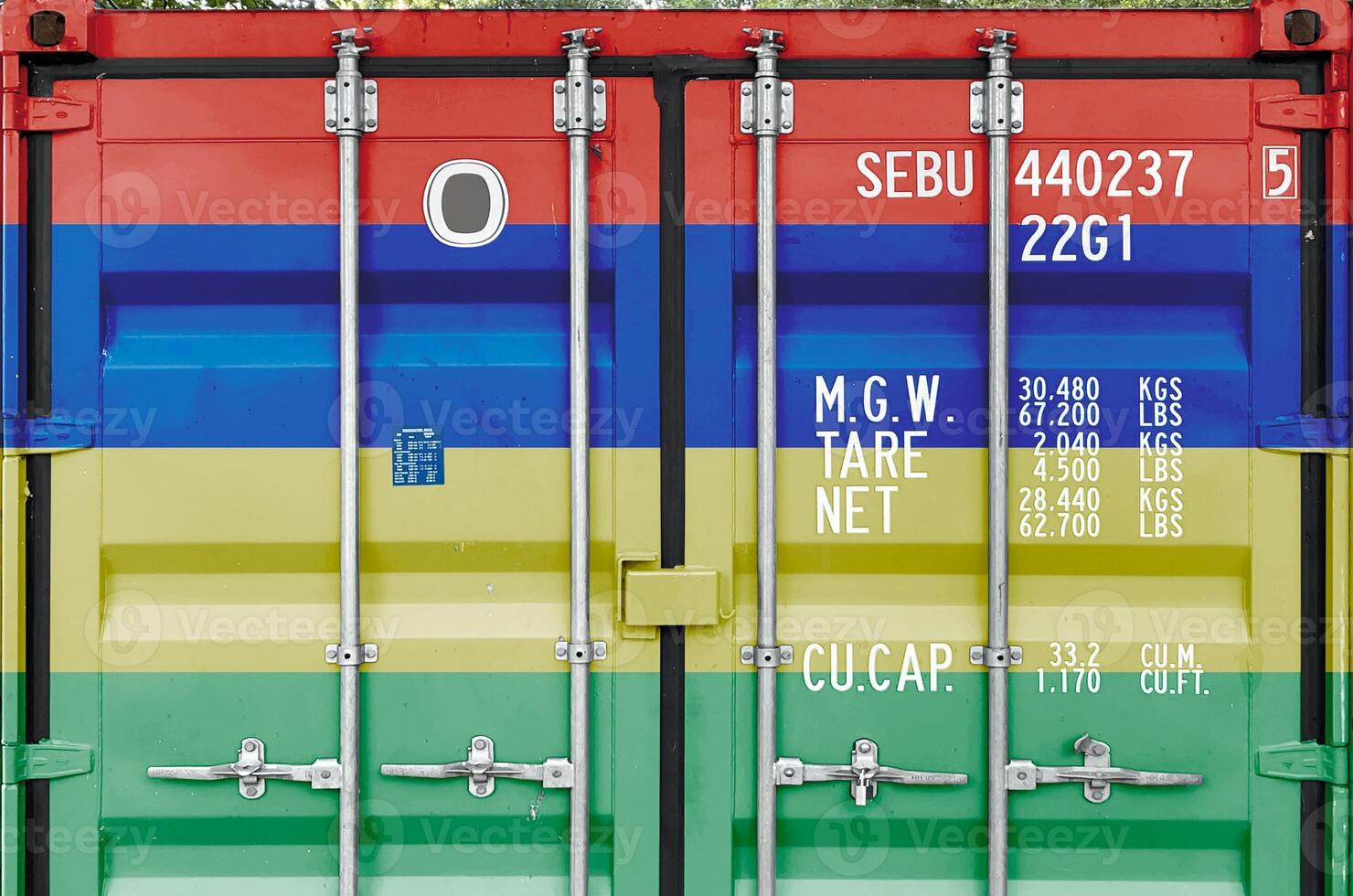 Mauritius flag depicted on metal doors of shipping cargo container outdoors in docks area photo