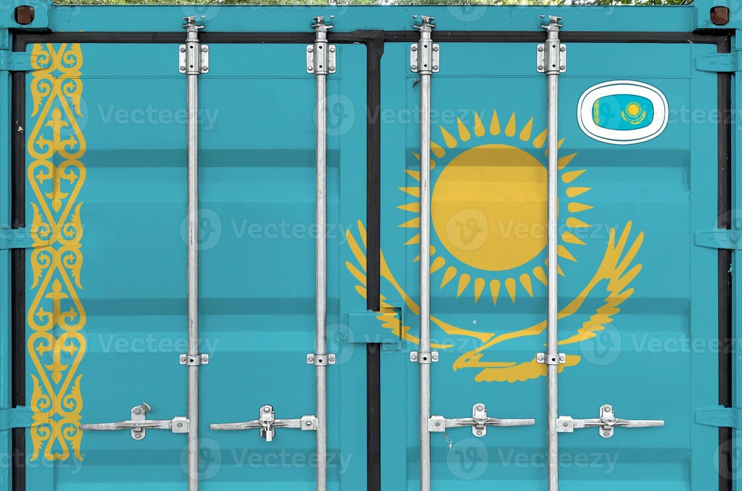 Kazakhstan flag depicted on metal doors of shipping cargo container outdoors in docks area photo
