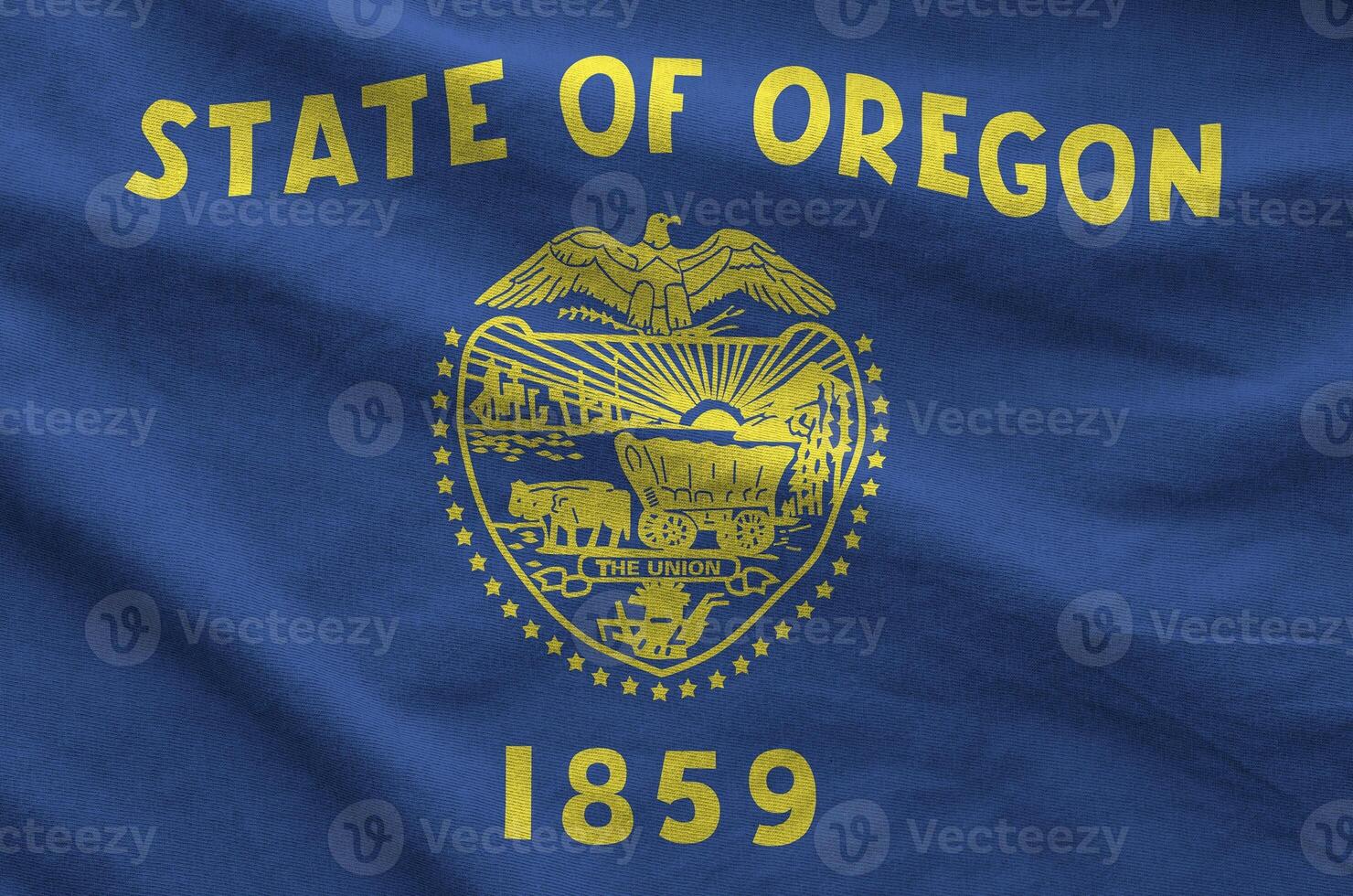 Oregon US state flag depicted on folded wavy fabric of old cloth photo