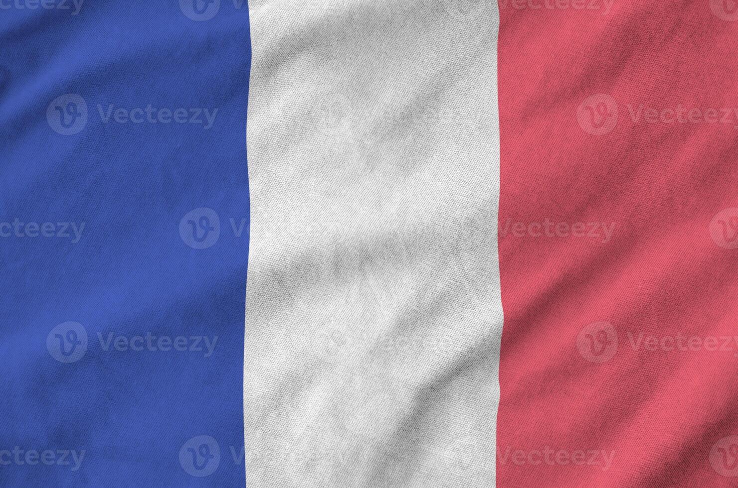 France flag depicted on folded wavy fabric of old cloth photo