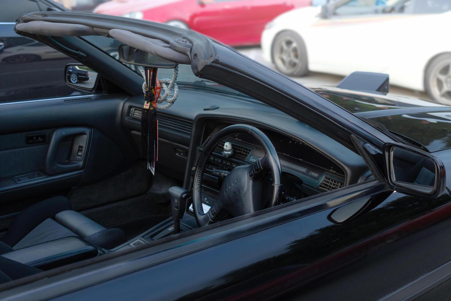 27.07.2024 Novosibirsk, Meet, Targa Car interior Toyota Supra a70 1990 in Black, pop-up headlights photo