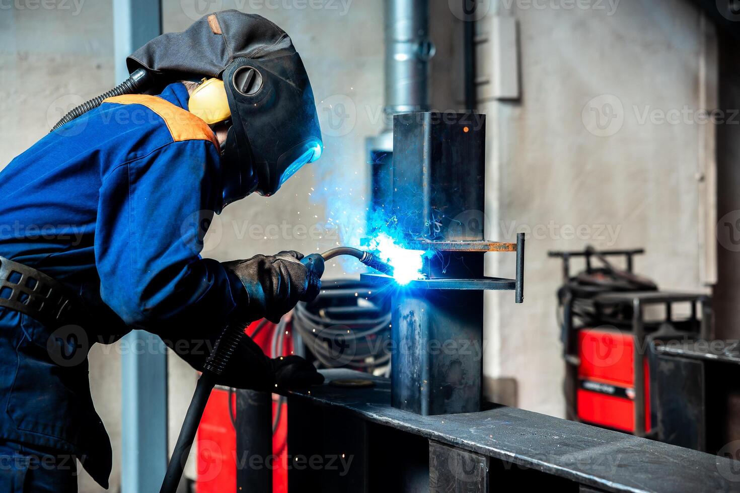 Skillful metal worker working with arc welding machine in factory while wearing safety equipment Metalwork manufacturing and construction maintenance service by manual skill labor concept photo