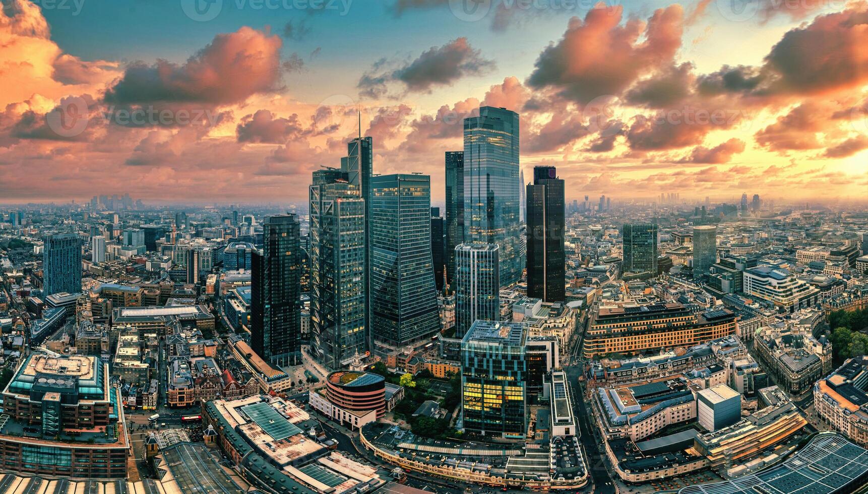 Aerial Drone View of London's Financial Center at Sunset, a Glowing Skyline of Modernity and Prosperity photo