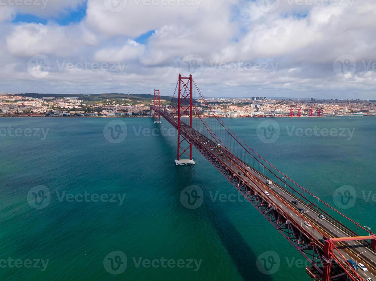 Lisbon, Portugal View of 25 de Abril Bridge famous tourist landmark of Lisbon connecting Lisboa and Almada on Setubal Peninsula over Tagus river . photo