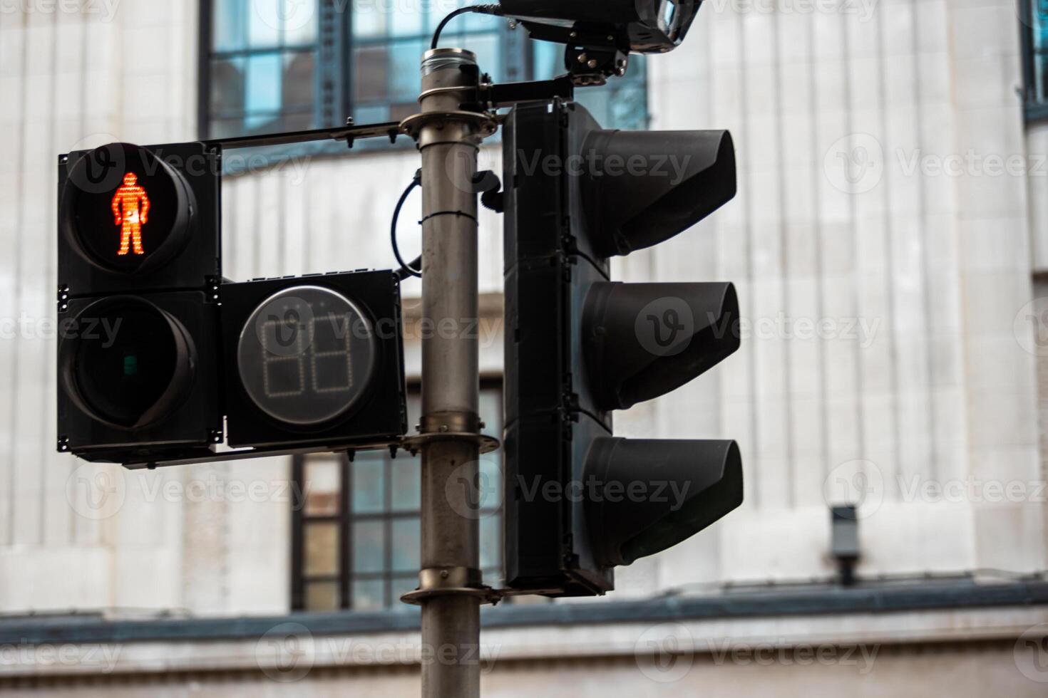 Close Up of Red Traffic Light Signaling No Crossing Allowed at Intersection. Restricted Pedestrian Movement photo