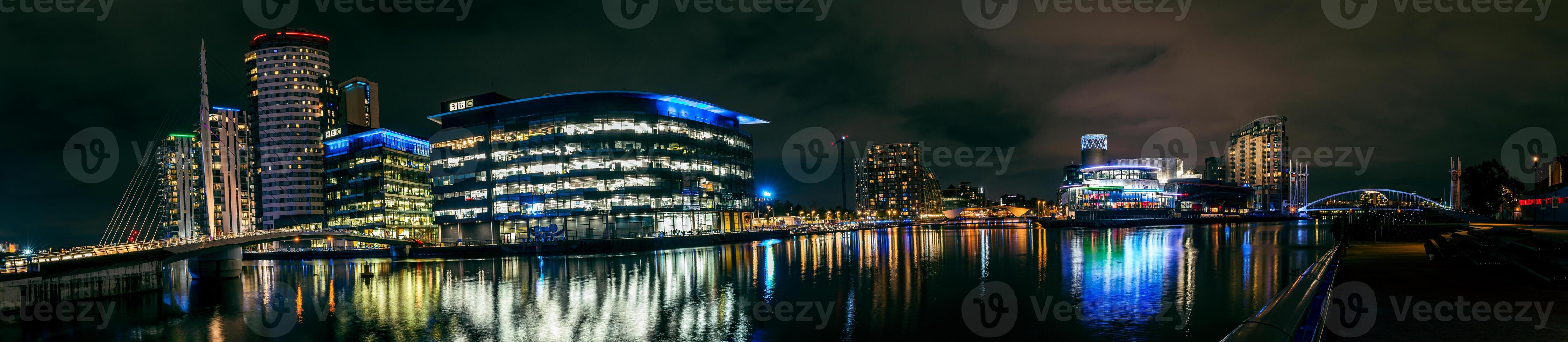 Manchester, UK. September 15, 2021 Night view of the Media City UK is on the banks of the Manchester Ship Canal in Salford and Trafford, Greater Manchester, England. photo
