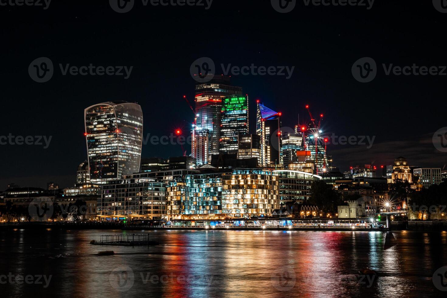 City of London one of the leading centres of global finance in night. Skyscrapers of over the Thames , England photo