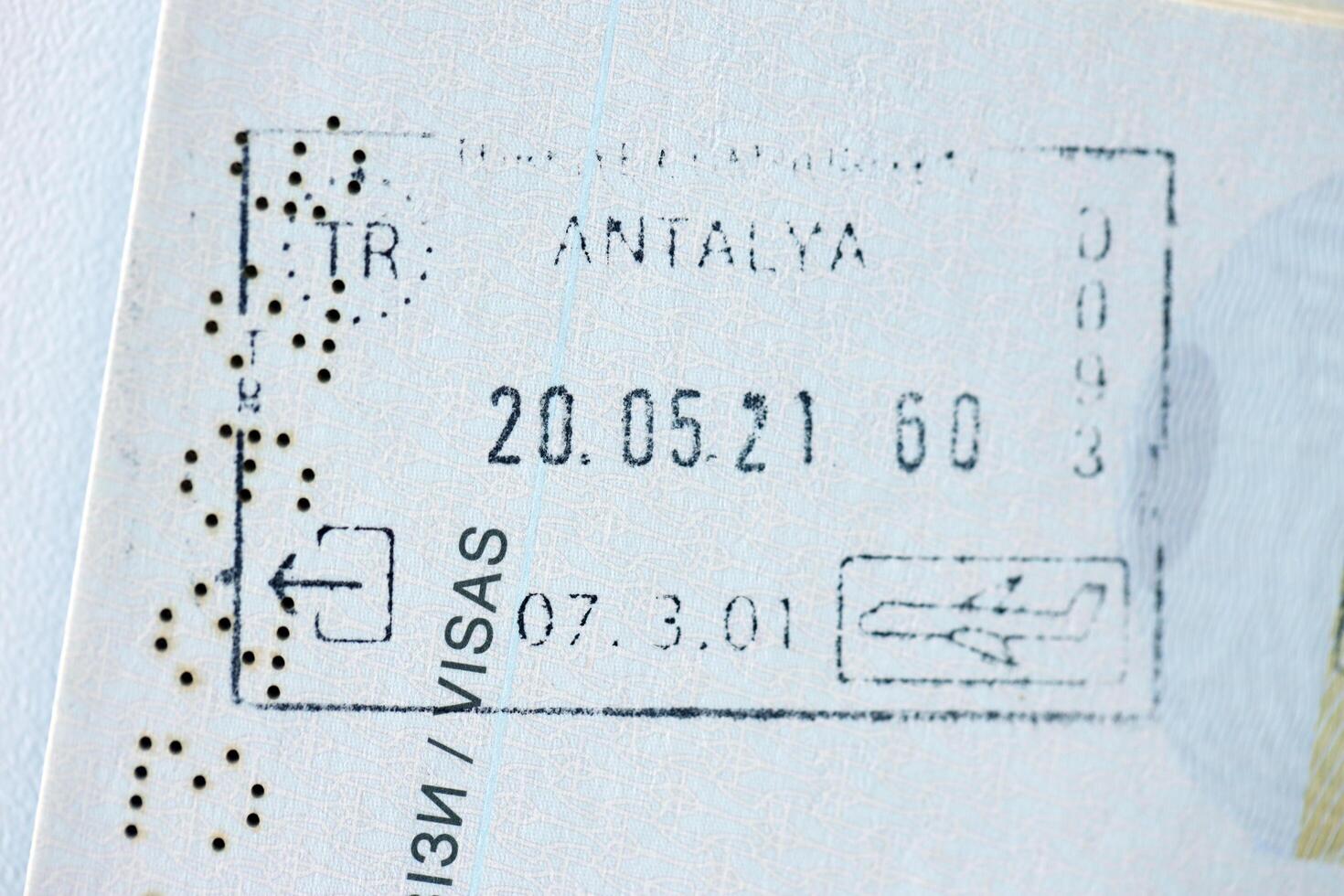 KYIV, UKRAINE - APRIL 20, 2024 Page of foreign passport with visas, Turkiye border stamps, permits to enter countries, concept of traveling around the world, travelers document photo