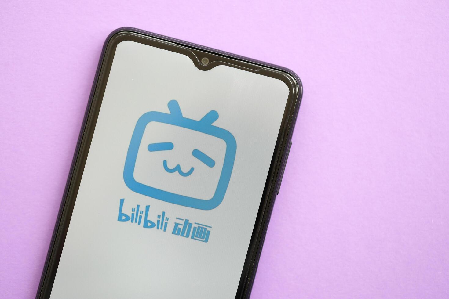 KYIV, UKRAINE - APRIL 1, 2024 Bilibili icon on smartphone screen on purple table photo