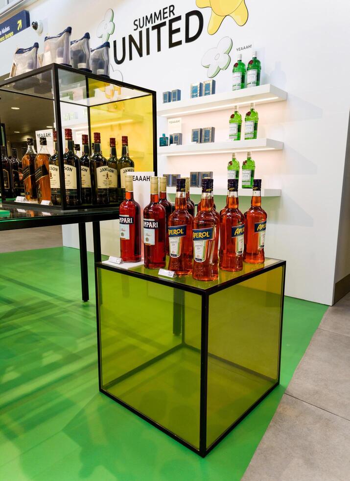 Vilnius, Lithuania, August 1, 2024 - Aperol and Campari bottles on shelf photo