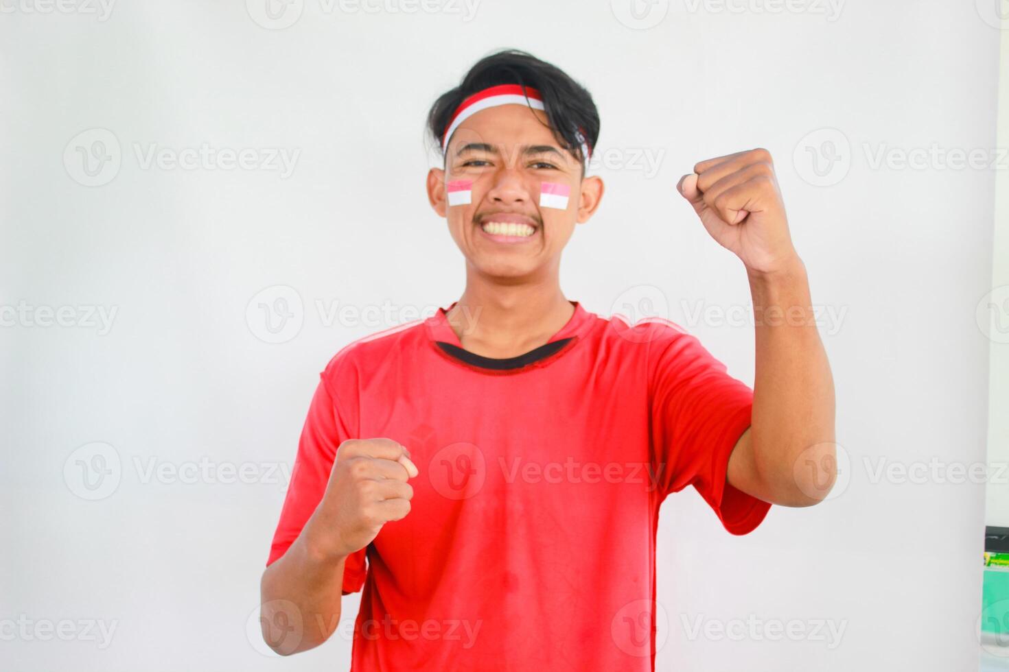 Indonesian man celebrate independence day with excited expression, Adult Asian man screaming enthusiast with both hands clenched photo