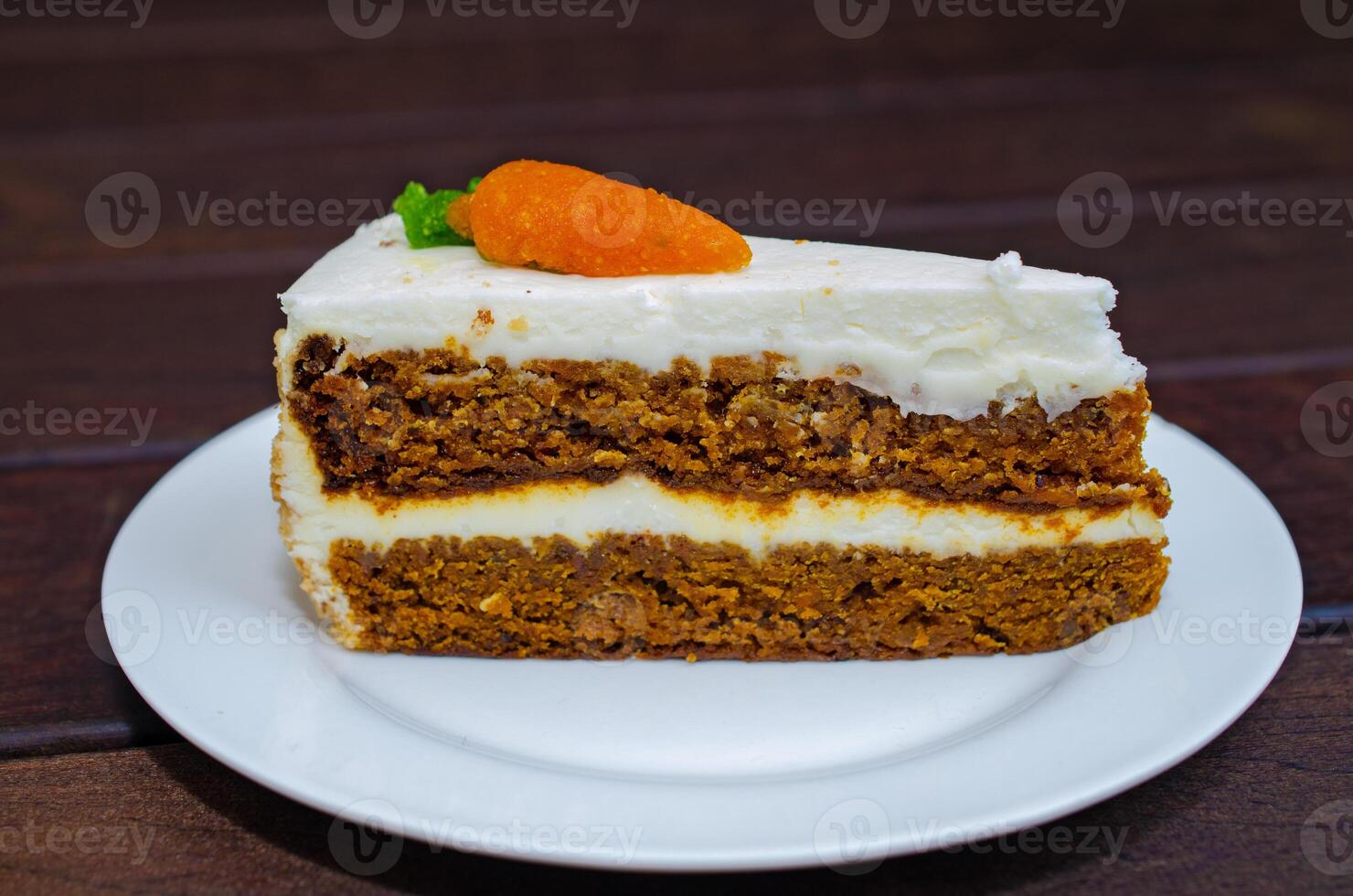 Carrot sponge cake with cream and walnuts photo