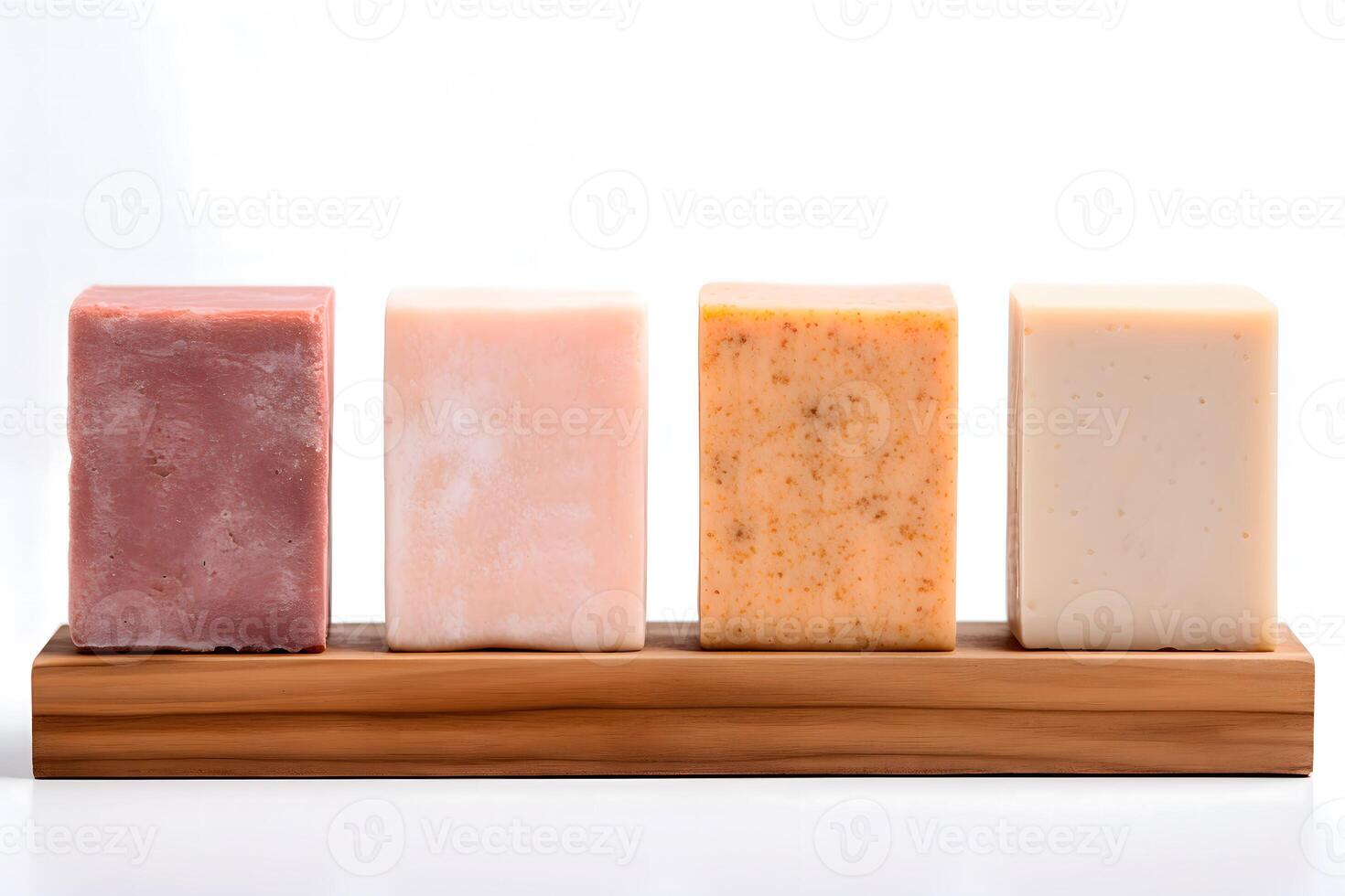 Pieces of natural soap of different scents on a wooden board on a white background. Soap making. Handmade soap photo