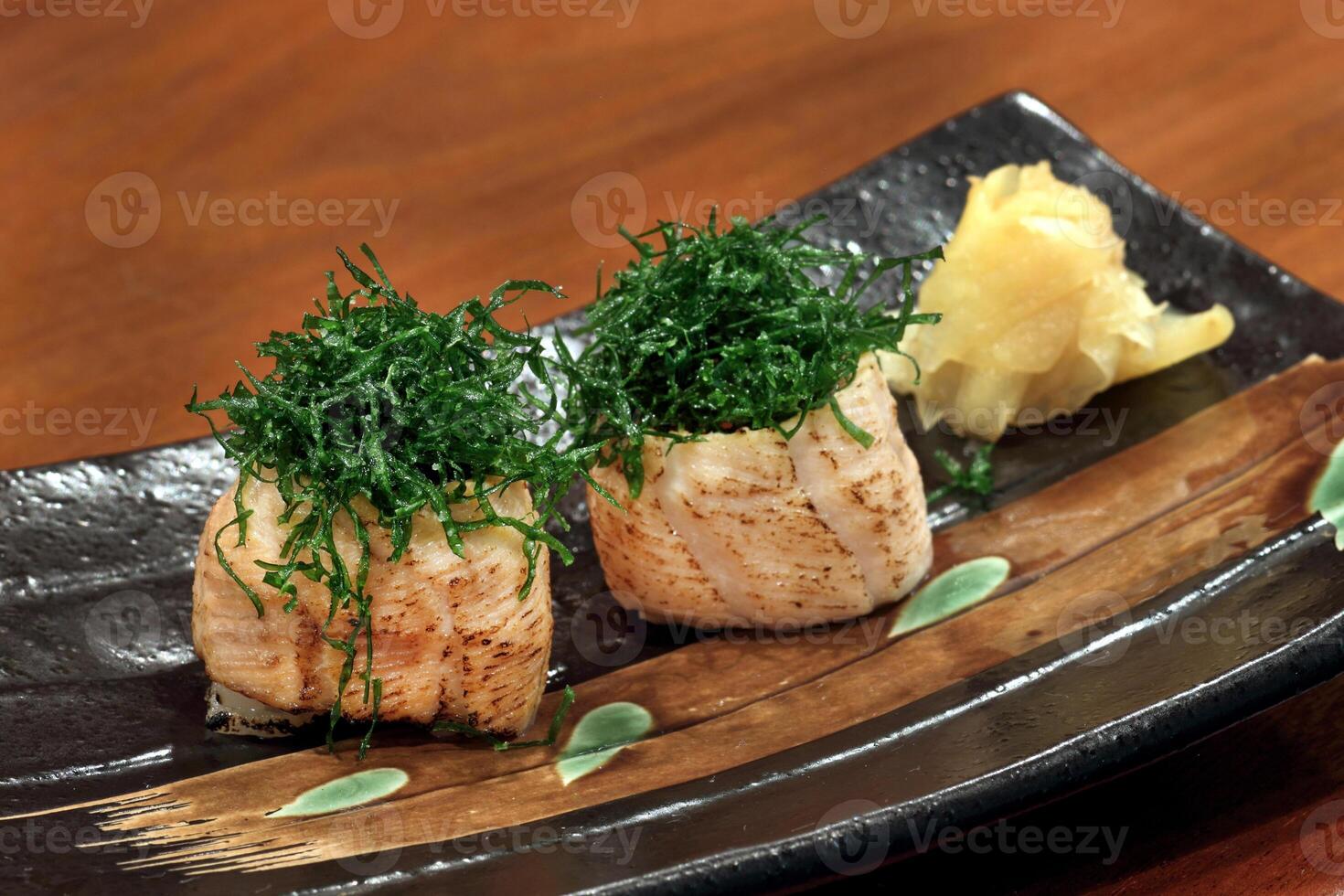 Sushi Joe Crispy Kale, salmon roll, cream cheese, fried kale and chives on plate photo