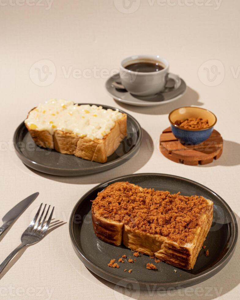 Roti Bakar is a typical grilled Indonesian sandwich, consisting of two slices of bread and filling, suitable to be served with Americano coffee. photo