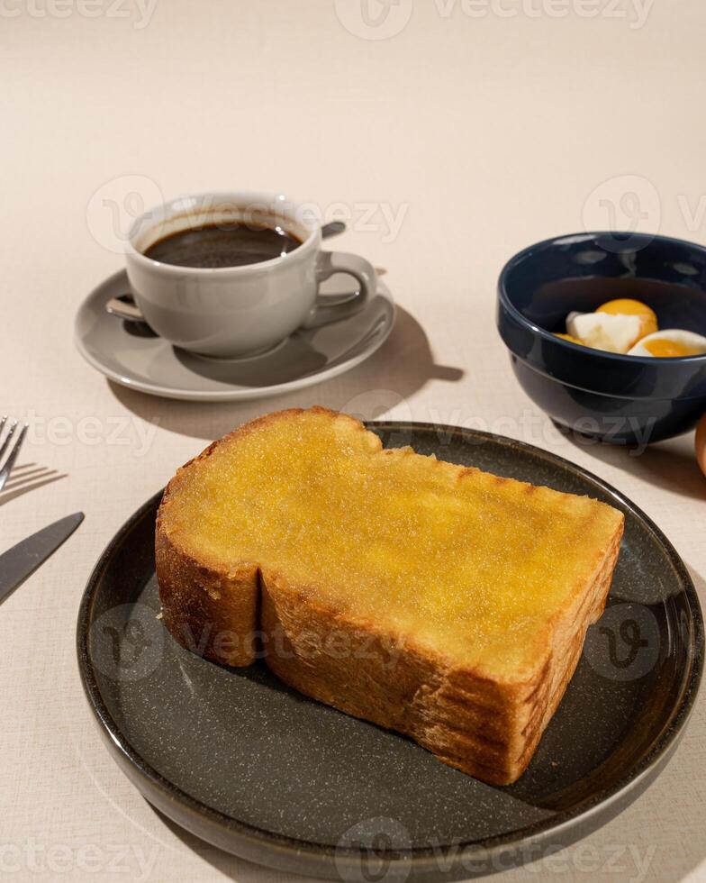 Roti Bakar is a typical grilled Indonesian sandwich, consisting of two slices of bread and filling, suitable to be served with Americano coffee. photo
