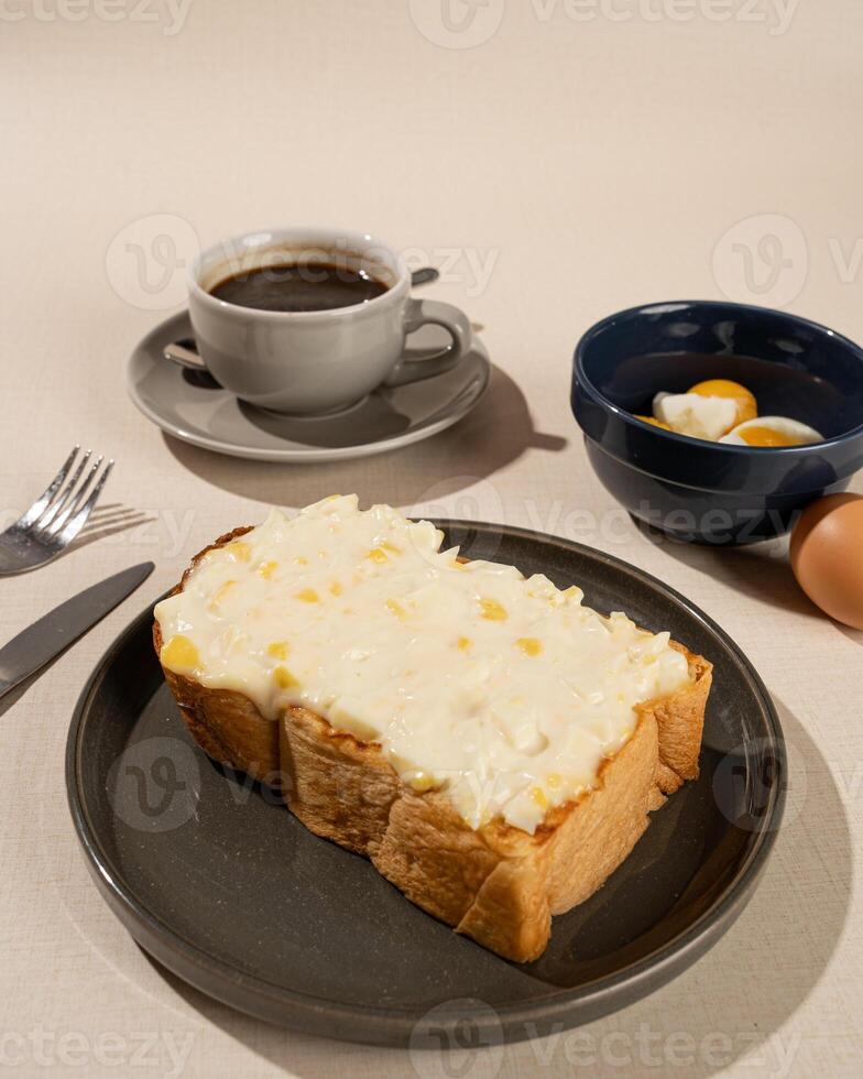 Roti burn is a typical grilled Indonesian sandwich, consisting of two slices of bread and filling, served with coffee americano photo