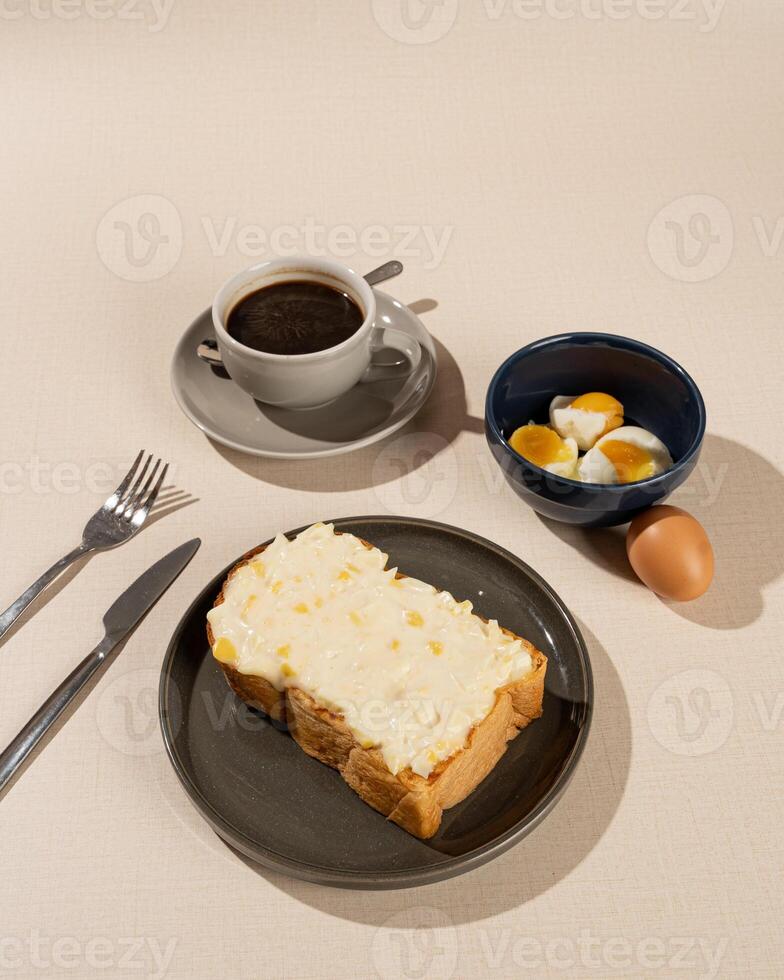 Roti burn is a typical grilled Indonesian sandwich, consisting of two slices of bread and filling, served with coffee americano photo