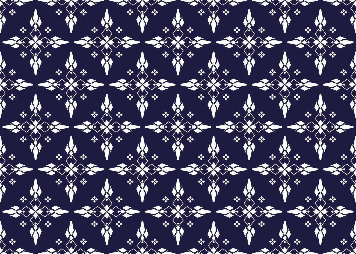 White geometric and symbol flowers design on dark blue background, ethnic fabric seamless pattern design for cloth, carpet, batik, wallpaper, wrapping etc. vector