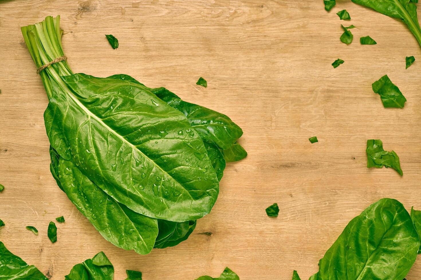 fresh organic spinach on a cutting board photo
