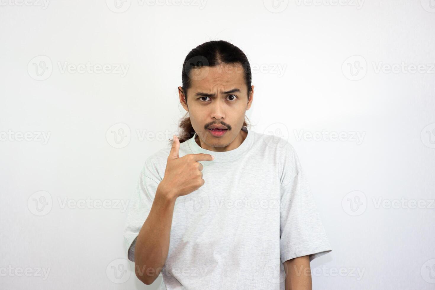 Upset and angry man with his hands on his waist. isolated on white background. photo
