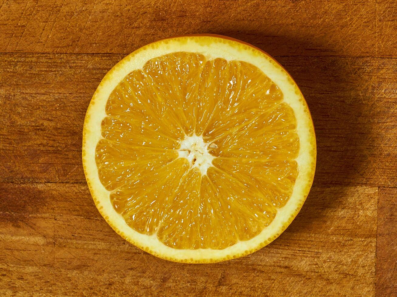 Slices of orange on a cutting board photo