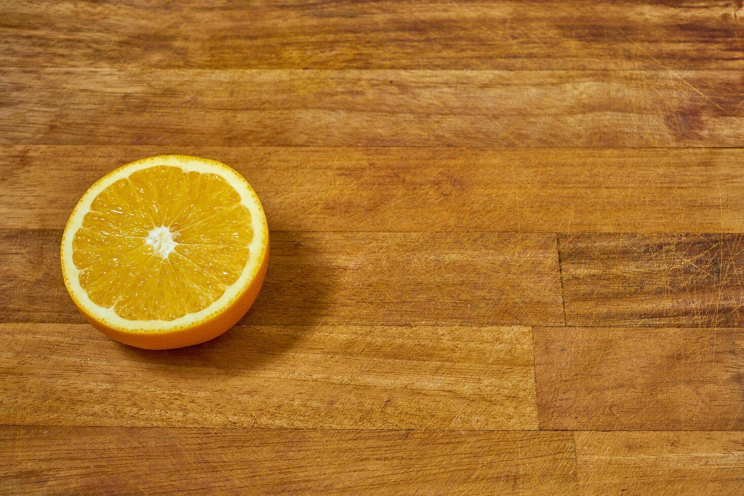 Slices of orange on a cutting board photo