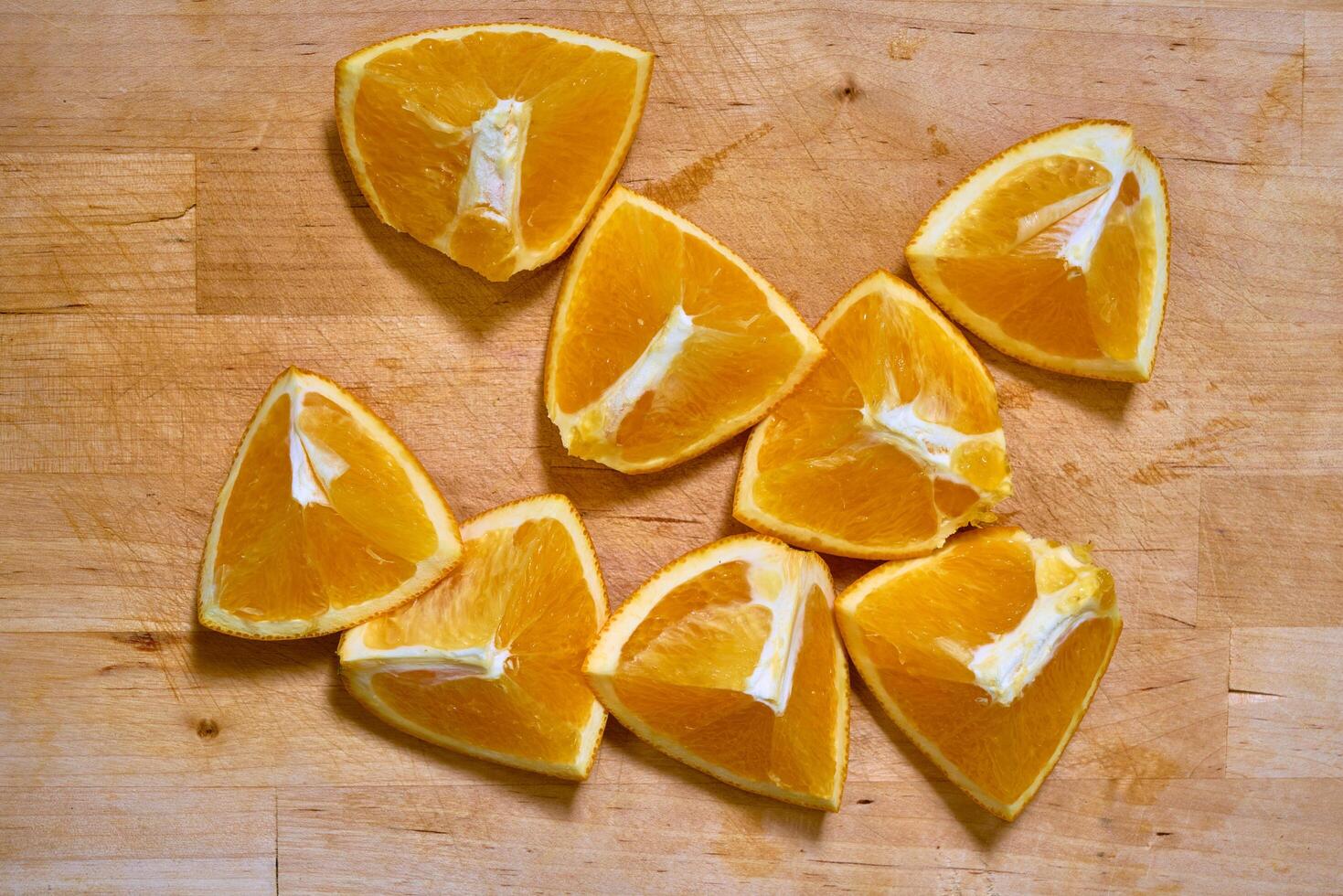 Slices of orange on a cutting board photo