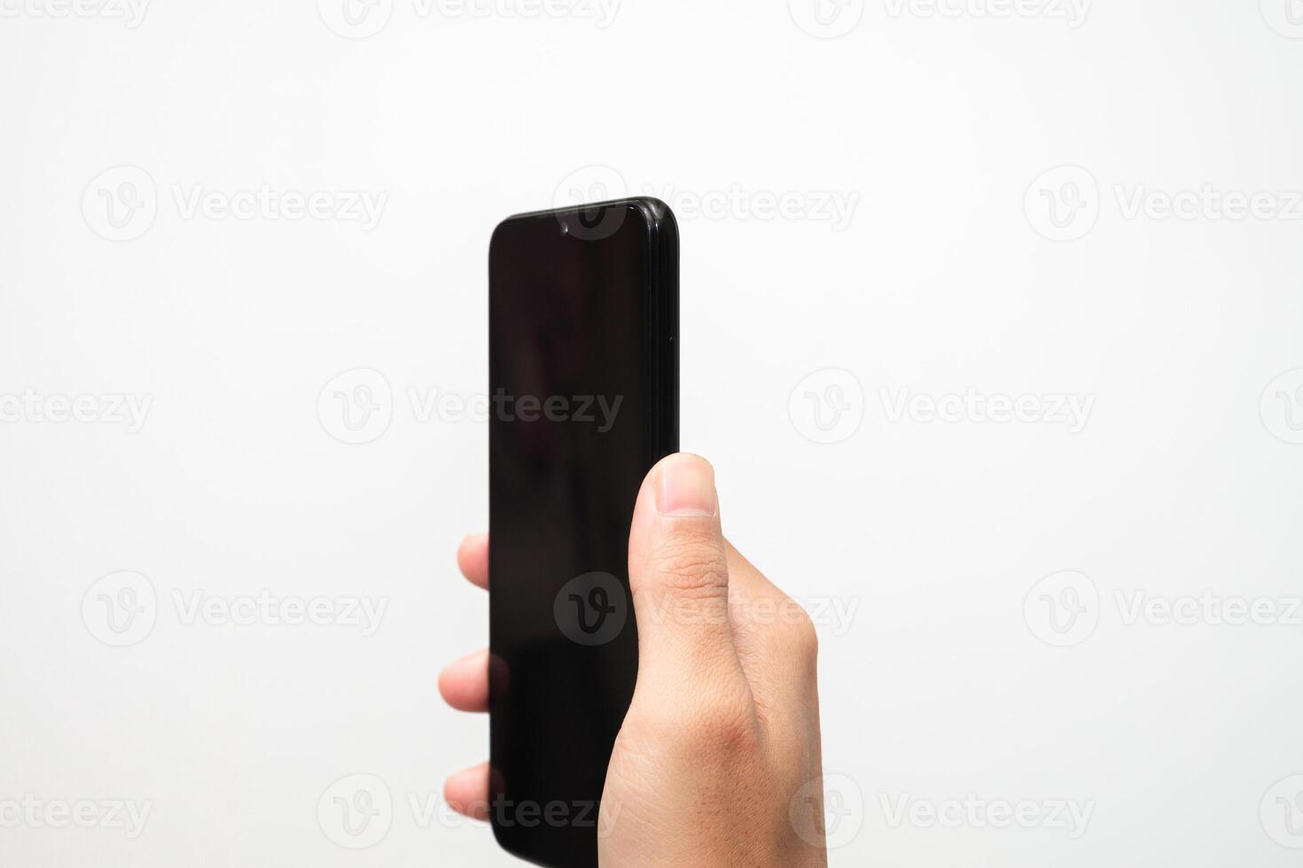 Man's hand holding a smart phone screen view from above. isolated in white background photo