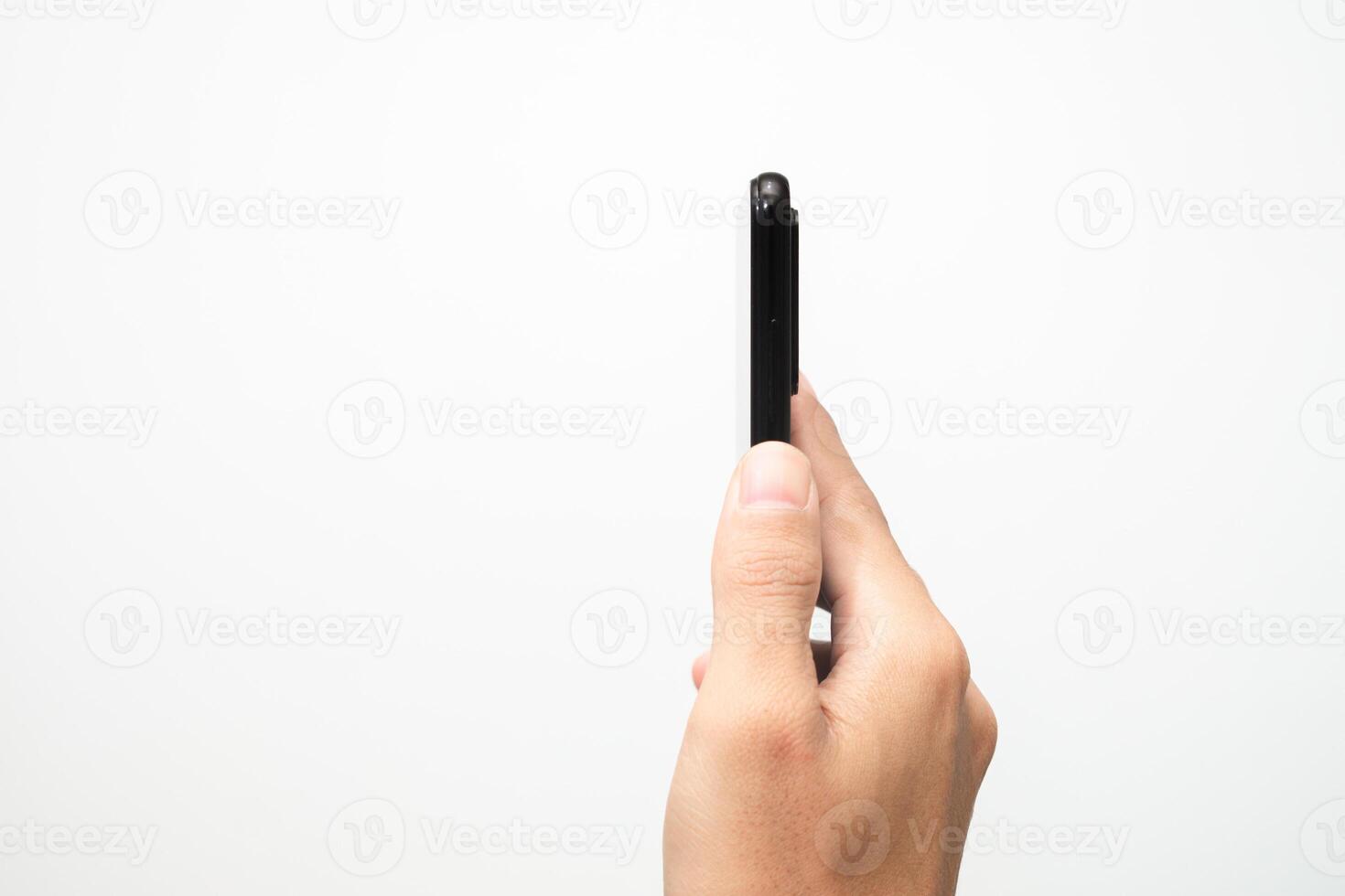 Man's hand holding a smart phone screen view from above. isolated in white background photo