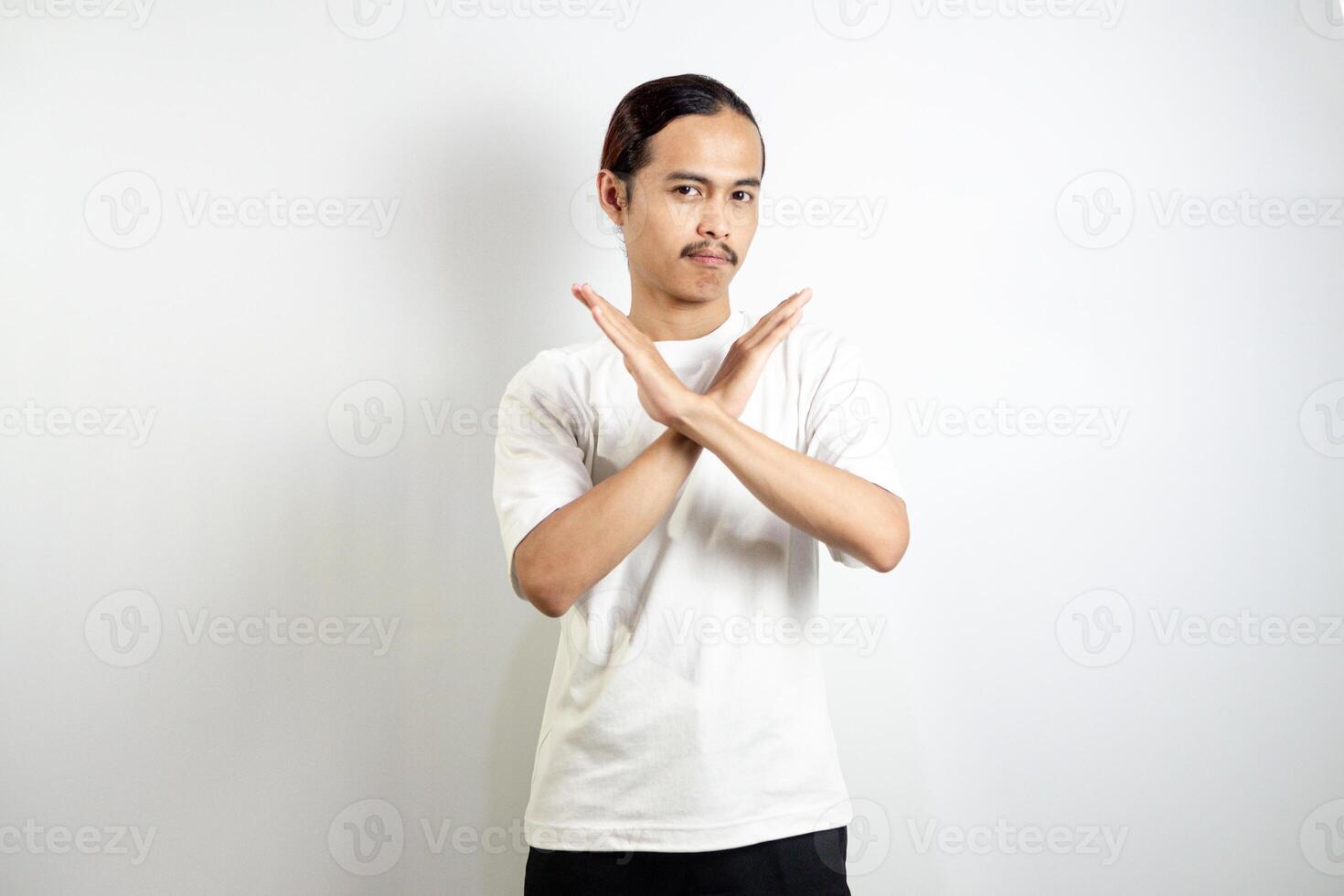 Young man wearing a white t-shirt. make movements not with your hands. crossed arms. There isn't any. sign isolated on white background photo