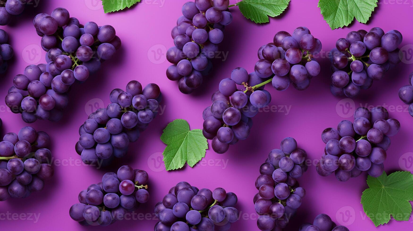 Pattern of bunch of red grapes with green leaves on purple background photo
