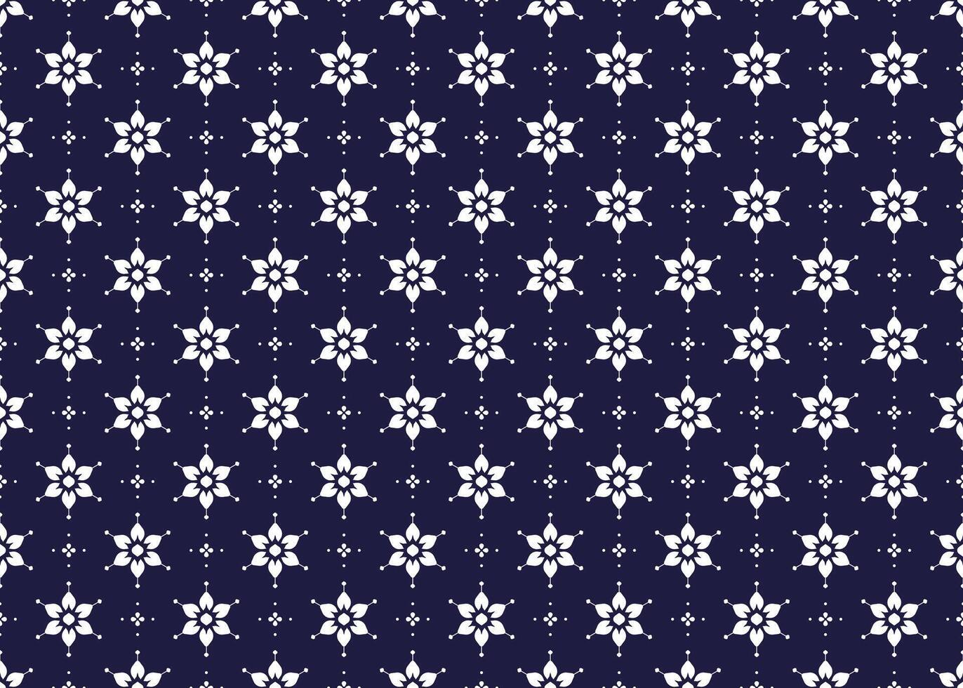 White symbol floral on dark blue background, ethnic fabric seamless pattern design for cloth, carpet, batik, wallpaper, wrapping etc. vector